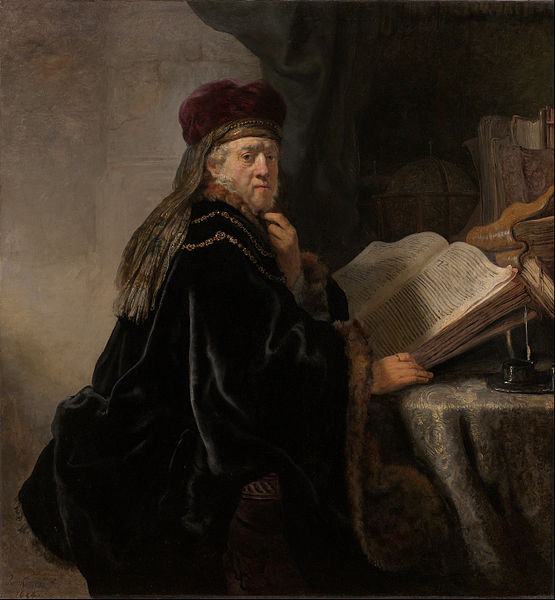 Um estudioso sentado a uma mesa com livros (Rembrandt) - Reprodução com Qualidade Museu